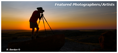 Karl Berdan stading on rock in front of sunset at Red Rock Coulee by Robert Berdan &copy;