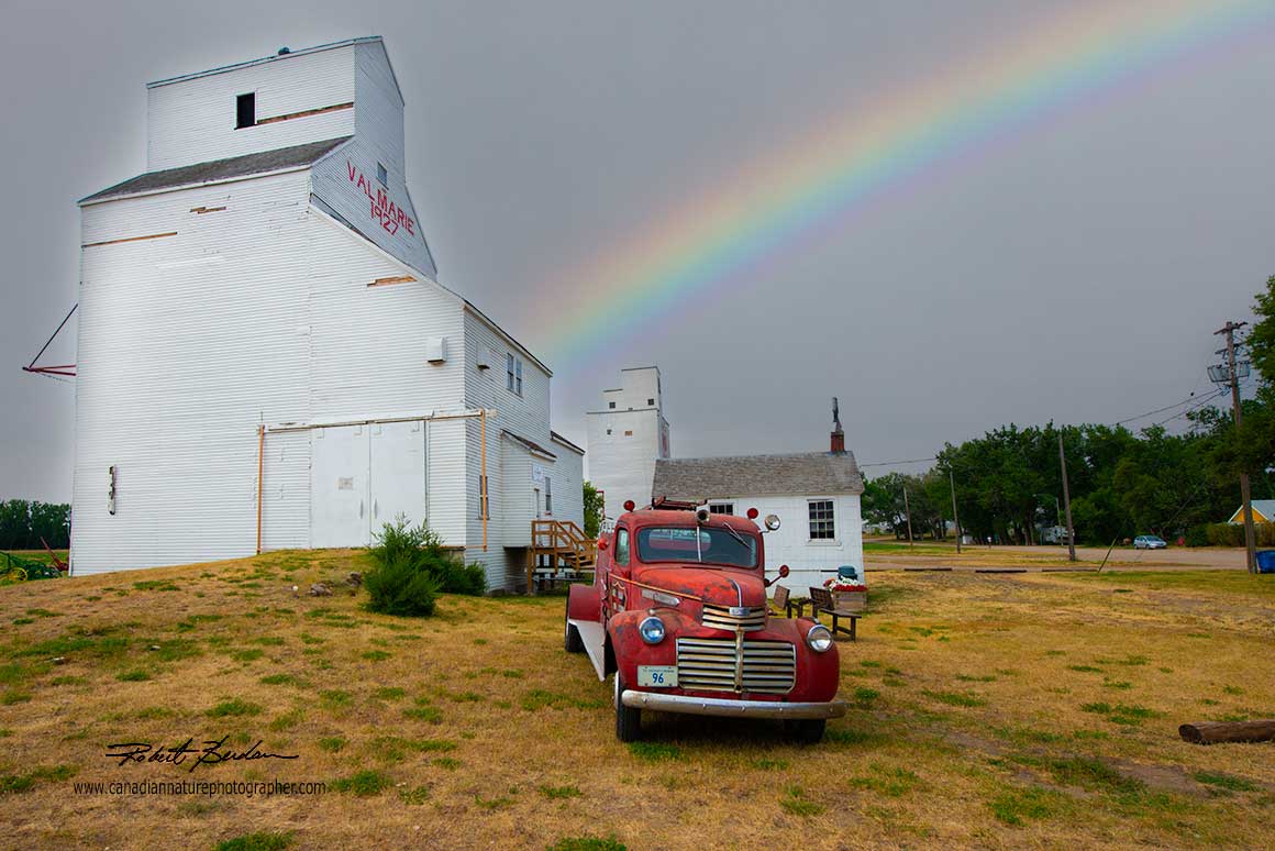 Grain elevator and old firetruck in Val Marie, SK by Robert Berdan ©