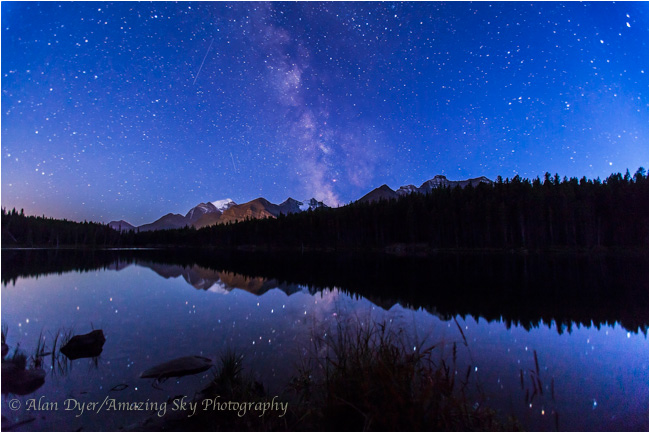 Milky Way in the summer twilight reflected in the still waters of Herbert Lake  by Alan Dyer ©