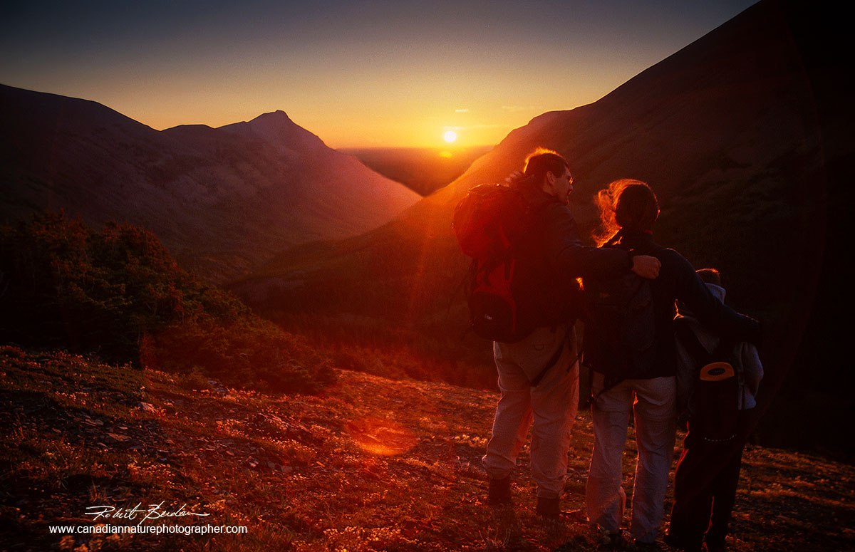 Family near the top of a mountain in the Castle Wilderness in South West Alberta at sunrise.Robert Berdan ©