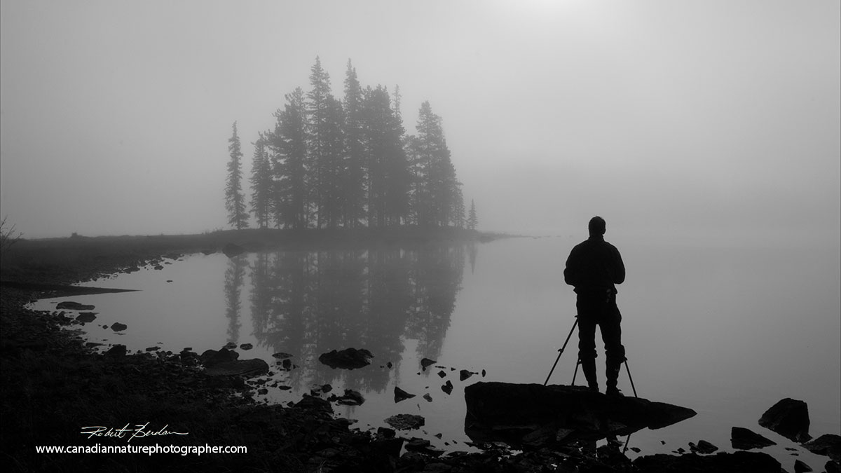Photographer at Spirit Island at sunrise in Jasper National Park Alberta by Robert Berdan ©