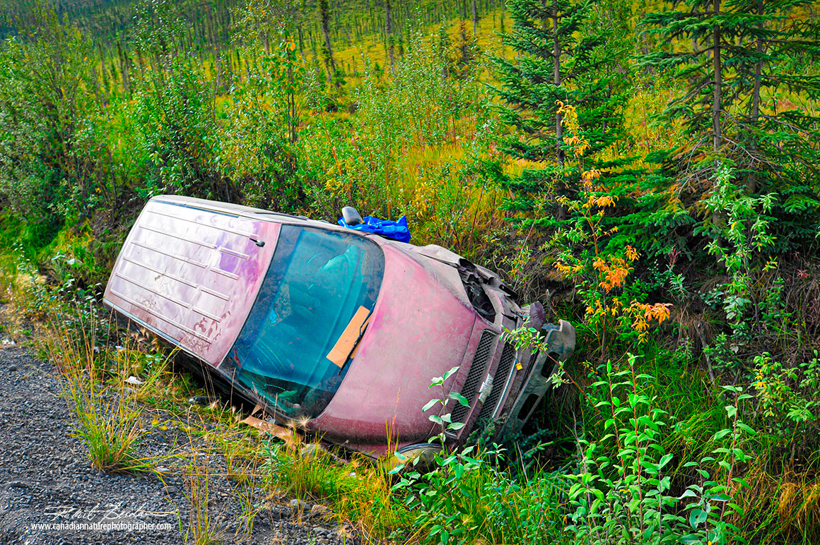 Vehicle in ditch beside he Dempster highway by Robert Berdan