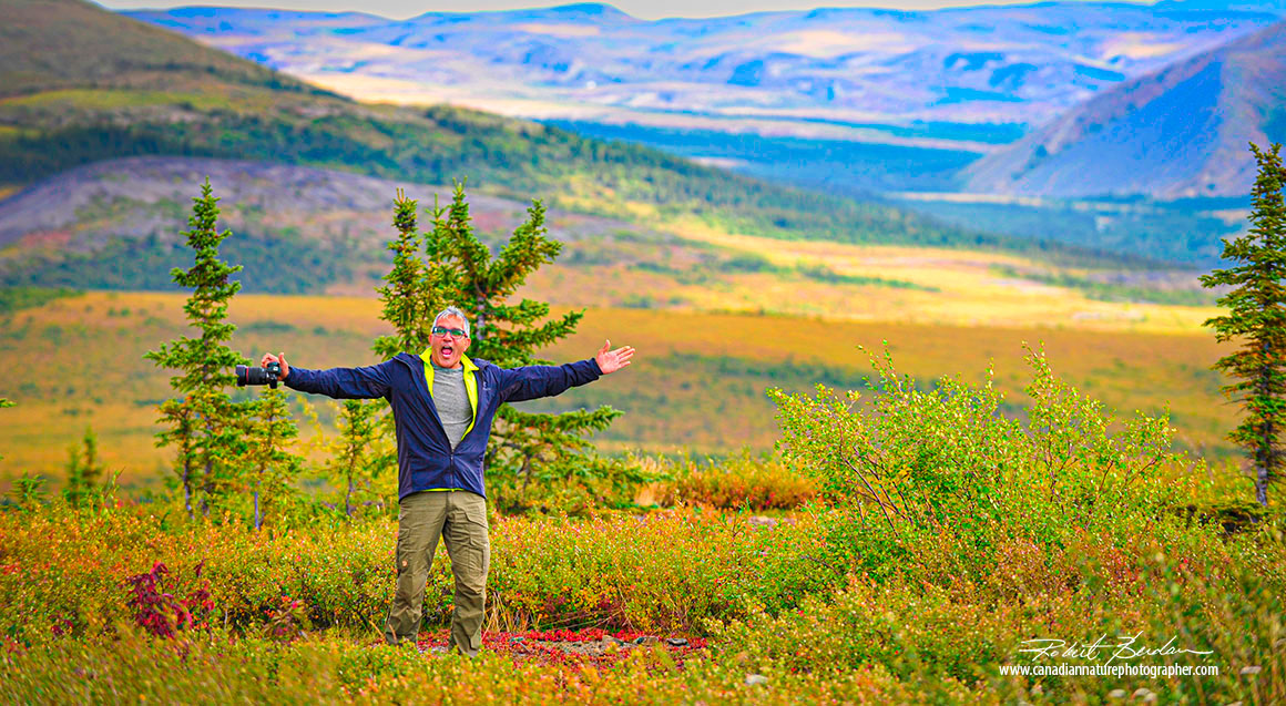 Kamal Varma next the Arctic circle along the Dempster highway
