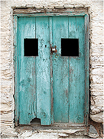 Locks on door in Lefkes, Paros by John Laprairie ©
