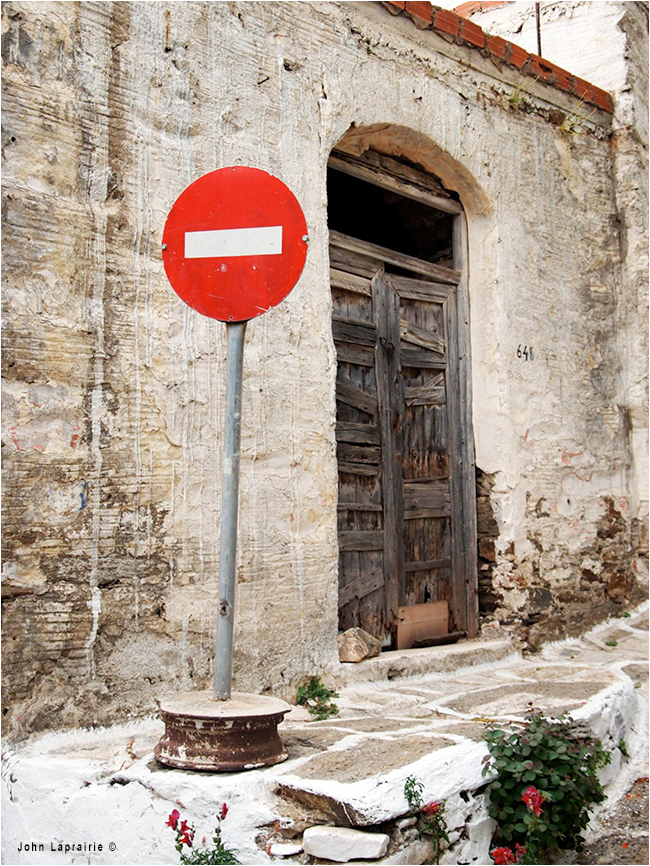 Don not enter in front of old door by John Laprairie ©