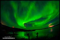 Aurora Borealis and distant lightening storm Prelude Lake near Yellowknife, NT by Robert Berdan