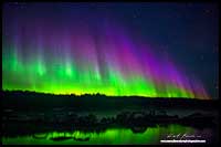 Aurora Borealis over boat dock on Prelude Lake, outside Yellowknife, NT by Robert Berdan 