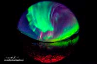 Aurora Borealis over Pontoon lake taken with a fisheye lens by Robert Berdan