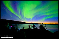 Photographers under the Aurora Borealis Prelude Lake near Yellowknife, NT by Robert Berdan