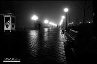 Black and white photo of Baltimore Harour walkway in fog by Robert Berdan