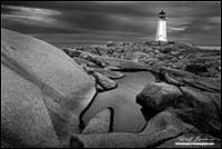 Black and white photo of Peggy's Cove Light house in Nova Scotia by Robert Berdan