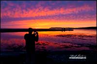 Photographer at sunset at Gros Morne National Park Newfoundland by Robert Berdan