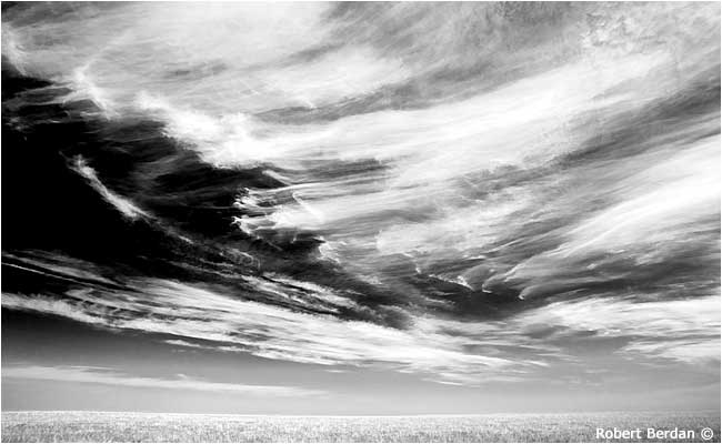 Cirrus clouds over Alberta prairie in black and white by Robert Berdan 