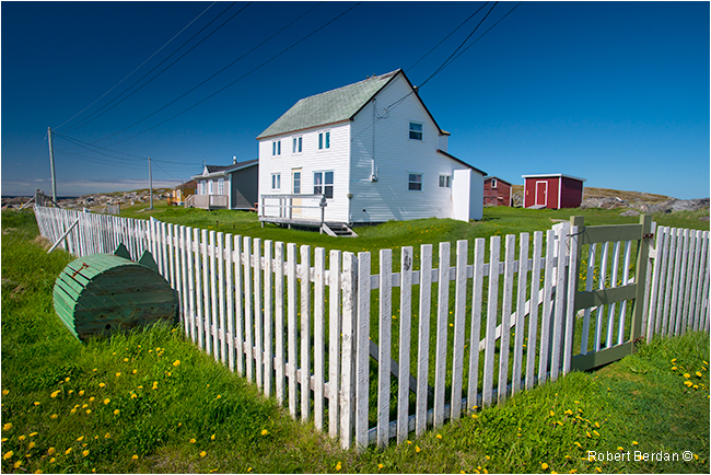 White picket fence and home in Tilting, Fogo Island Newfoundland by Robert Berdan ©