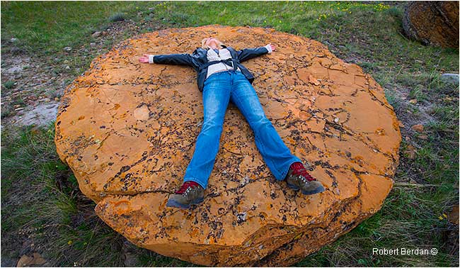 Donna Berdan lying on a concretion at Red Rock Coulee by Robert Berdan ©