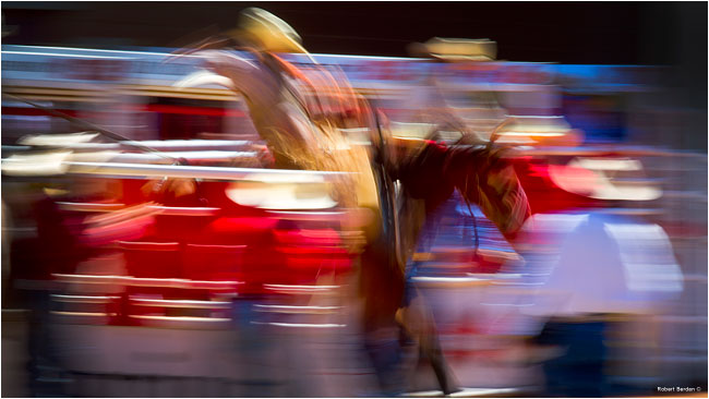 Slow shutter speed and pan of horse back rider Calgary Stampede by Robert Berdan 
