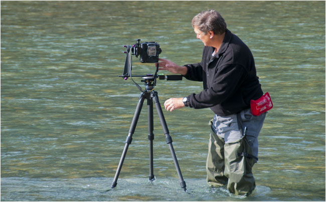 Robert Berdan in river with Velbon tripod and panoramic head by Karl Berdan ©