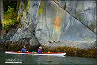 First Nations pictograph and kayakers near Broughton Archipelago British Columbia by Robert Berdan 